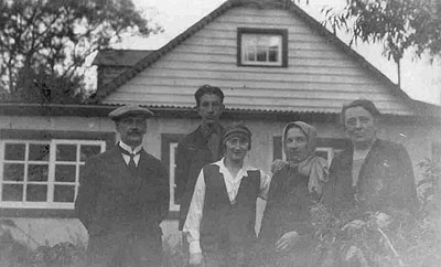 family beside house